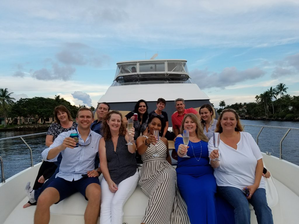 All the people raising their glasses for a picture